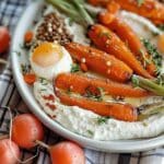 Rose Harissa Roasted Carrots over Hummus
