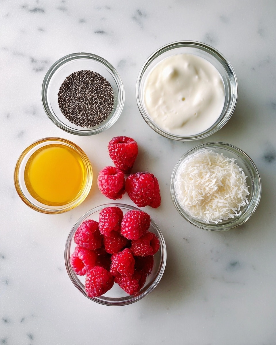 The image shows five small clear glass bowls and several fresh red raspberries arranged on a white marbled surface. The top left bowl contains tiny black chia seeds, the top right bowl is filled with thick white yogurt, the bottom left bowl has golden honey, the bottom middle bowl holds white coconut milk, and the bowl on the right side near the bottom holds white shredded coconut. The raspberries are in the center, bright and textured with small details. The arrangement is neat and simple. Photo taken with an iphone --ar 4:5 --v 7