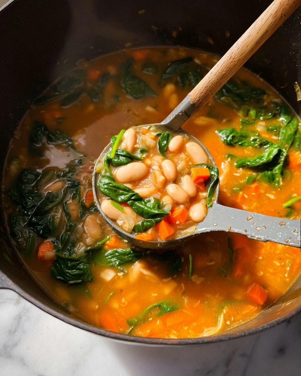 A close-up view of a black pot filled with a bright orange broth soup that has visible layers of ingredients. The top layer shows fresh green leafy spinach scattered throughout. Mixed inside the broth are soft white beans, small orange carrot cubes, and translucent light onions. A gray ladle with a wooden handle is scooping some of the soup, showing the mix of beans, carrots, onions, and spinach in its bowl. The pot sits on a white marbled surface, and steam gently rises from the hot soup. Photo taken with an iphone --ar 4:5 --v 7