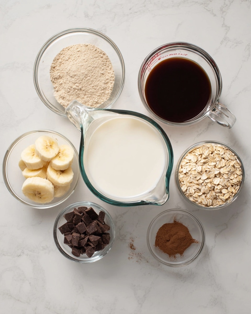 The image shows seven clear glass bowls and measuring cups arranged on a white marbled surface. In the center is a large glass measuring cup filled with white milk. To the left of it, there is a glass measuring cup filled with dark brown liquid, likely syrup. Surrounding these are smaller glass bowls: the top left bowl contains light beige powder, the top middle bowl has sliced yellow banana pieces, the top right bowl holds dark brown cocoa powder, the bottom right bowl contains pale beige rolled oats, and the small bowl just above it has a small amount of brown cinnamon powder. The clear glass containers allow the textures and colors of the ingredients to be seen clearly. photo taken with an iphone --ar 4:5 --v 7
