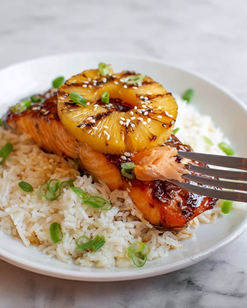 The dish shows a white plate with three parts: at the bottom, a layer of white cooked rice sprinkled with green onion slices; on top of the rice, a thick piece of cooked salmon with a golden brown sear; the top layer has three grilled pineapple rings, caramelized with dark brown edges, sprinkled with white sesame seeds and more green onion slices; a fork lifts a piece of salmon from the right side; the whole plate sits on a white marbled surface. photo taken with an iphone --ar 4:5 --v 7
