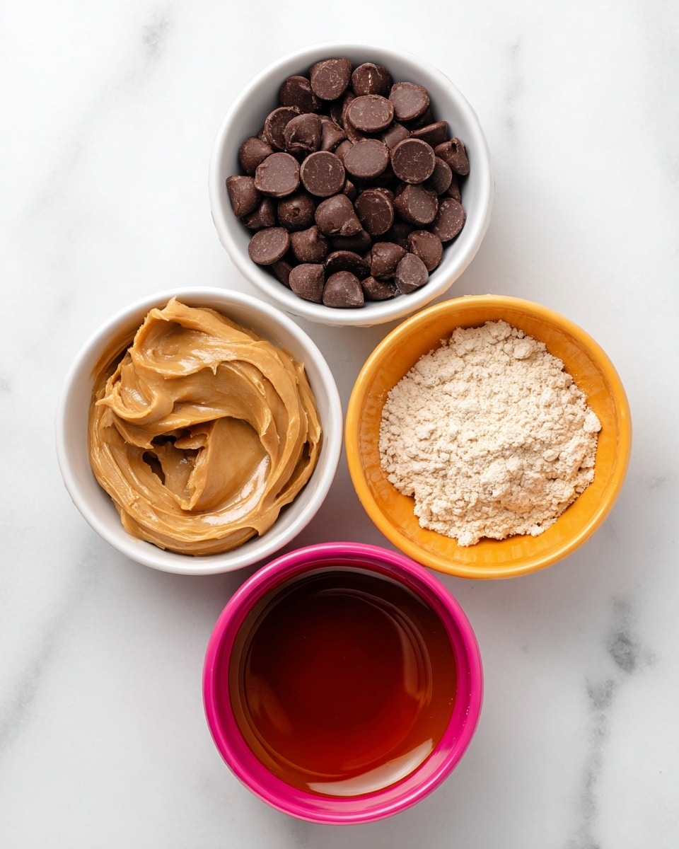 Four small white bowls are shown from the top, each filled with different ingredients and arranged in a square shape on a white marbled surface. The top left bowl holds many small, shiny dark brown chocolate chips with a round, flat shape. The top right bowl contains a light beige powdery flour that is piled unevenly. The bottom left bowl is filled with smooth, creamy peanut butter that has a light brown color and slight swirls on its surface. The bottom right bowl has a dark amber liquid with a glossy look and a smooth surface. photo taken with an iphone --ar 4:5 --v 7